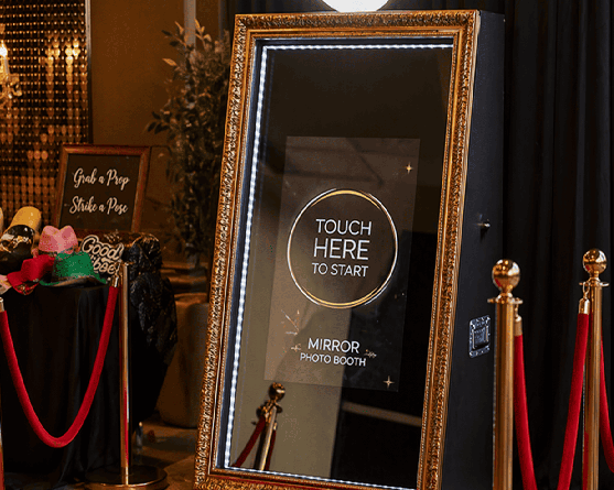 Mirror photo booth setup at a luxury event in Toronto with red carpet and interactive touch screen