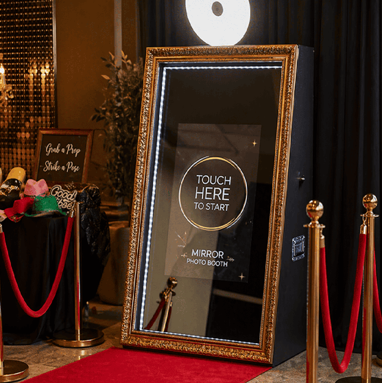 Mirror photo booth setup at a luxury event in Toronto with red carpet and interactive touch screen
